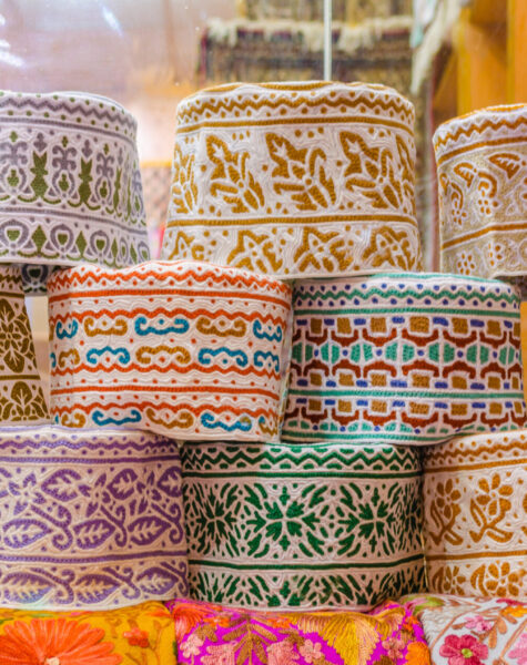 Colorful Omani Caps on retail display during Ramadan.